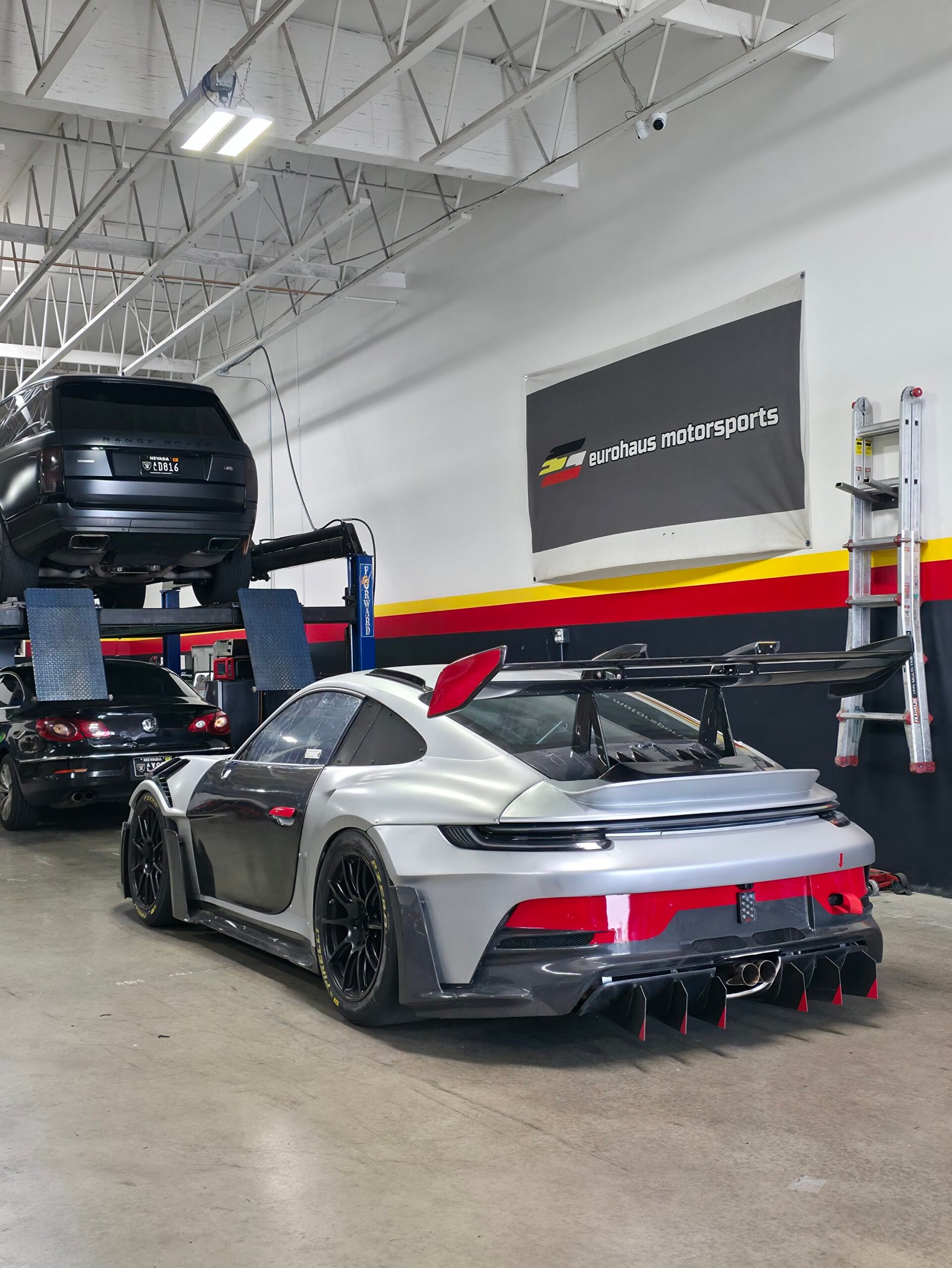 Vehicles on lifts inside the Eurohaus Motorsports shop in Las Vegas